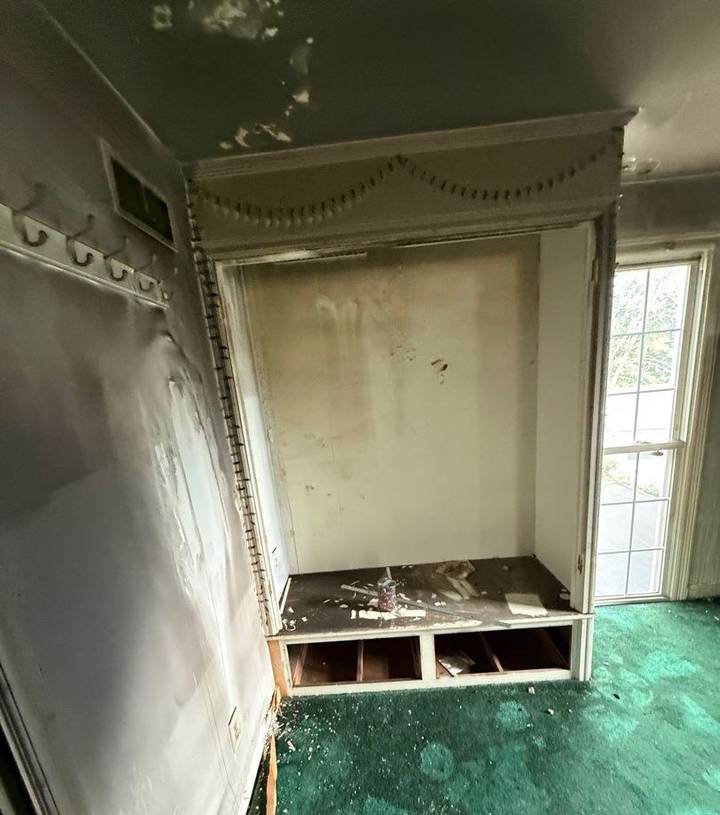 Smoke-damaged built-in nook with blackened walls